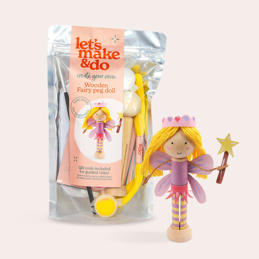 Wooden fairy peg doll with packaging on a white background