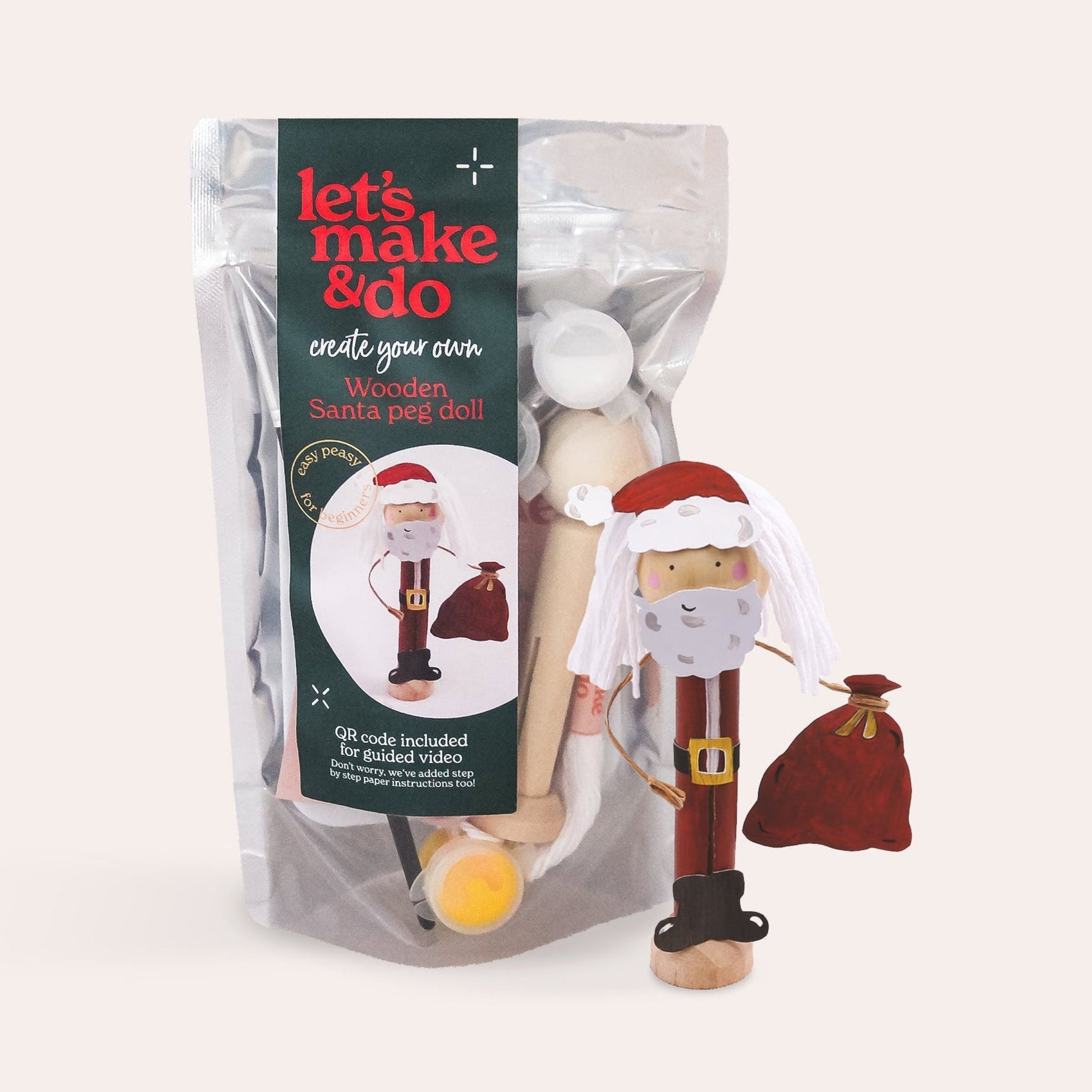 Packaged wooden Santa craft kit with a white background