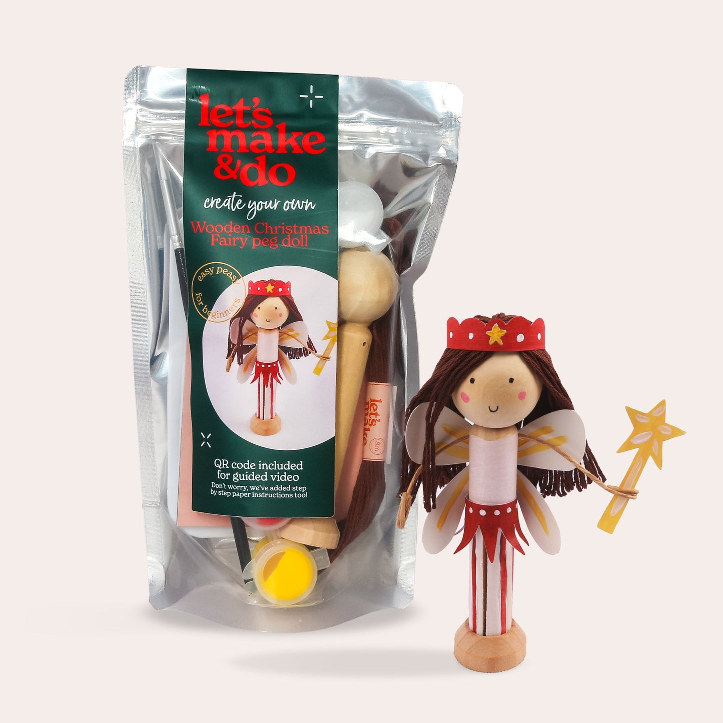 Childrens peg doll kit with packaging labelled 'let's make & do' on a white background